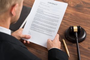 Lawyer holding a contract.